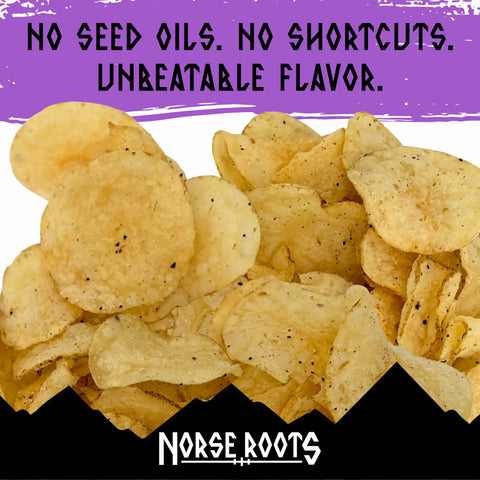 A pile of seasoned potato chips with salt and black pepper, set against a graphic background with a purple top banner reading 'NO SEED OILS. NO SHORTCUTS. UNBEATABLE FLAVOR.'