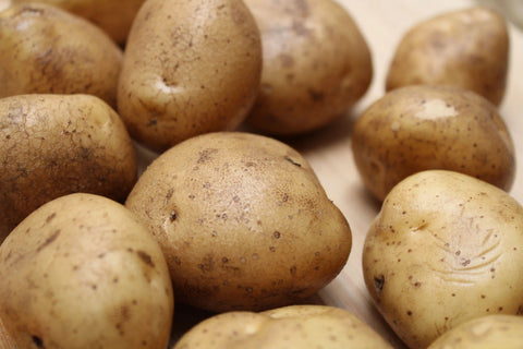 fresh, clean raw potatoes used to make Norse Roots chips